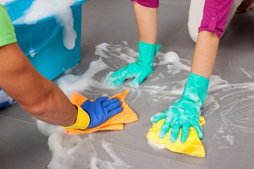 Carpet cleaning team preparing equipment safely